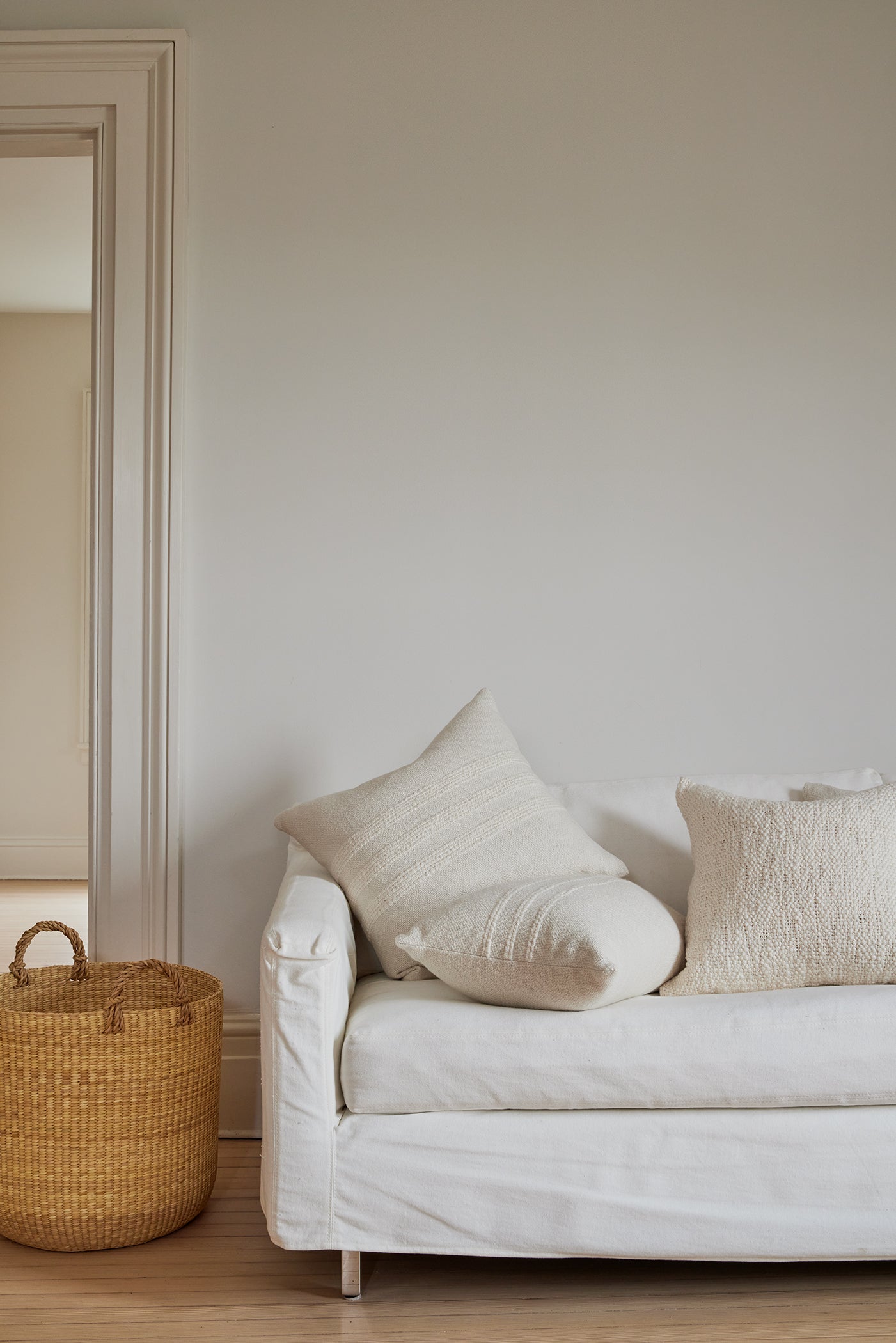 Intiearth luxuriously soft organic handspun cotton 24" square pillow in ecru, perfect for adding comfort and a natural touch to any sofa or bed.