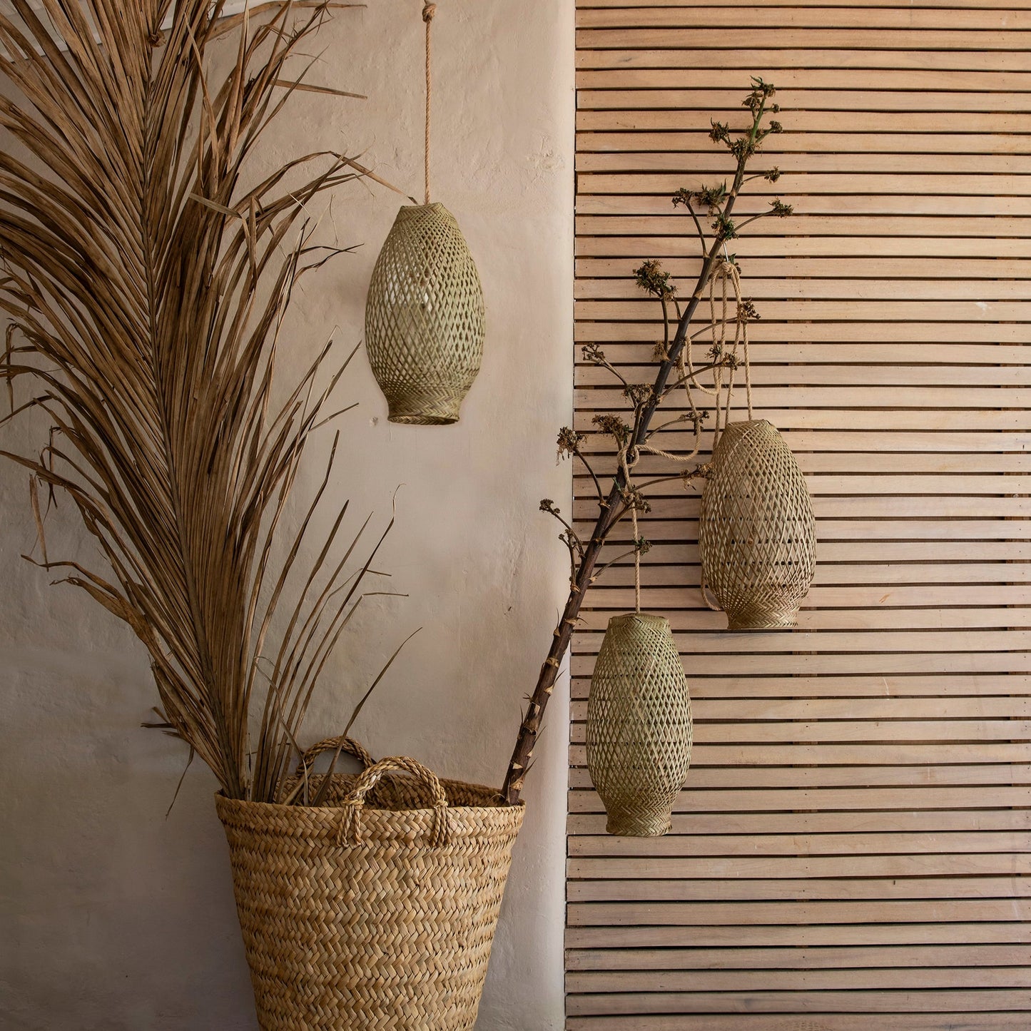 Intiearth Handwoven wicker pendant lamp with a natural, rustic design, casting a warm, inviting glow—perfect for adding an artisanal touch to any room.