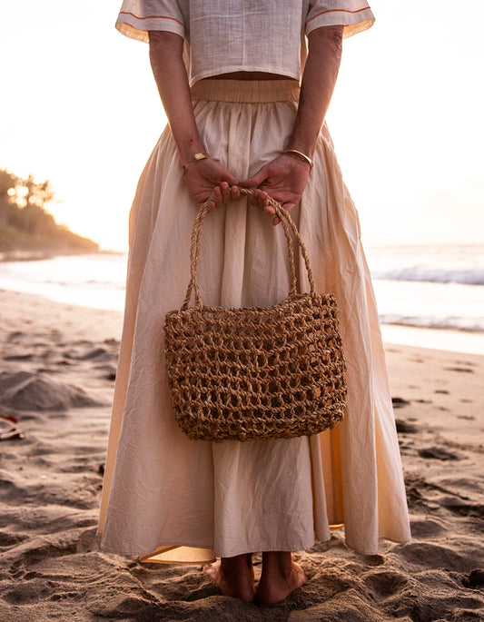 Intiearth Handwoven tote bag inspired by the ancient shicra style, made from natural fibers with an open weave pattern.