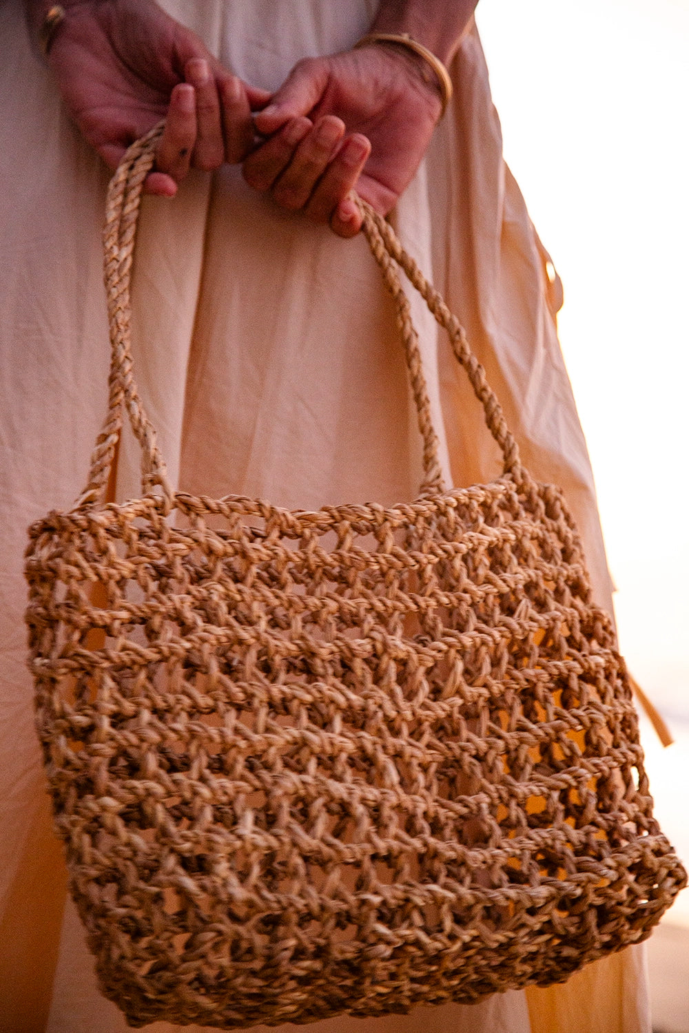 Intiearth Handwoven tote bag inspired by the ancient shicra style, made from natural fibers with an open weave pattern.