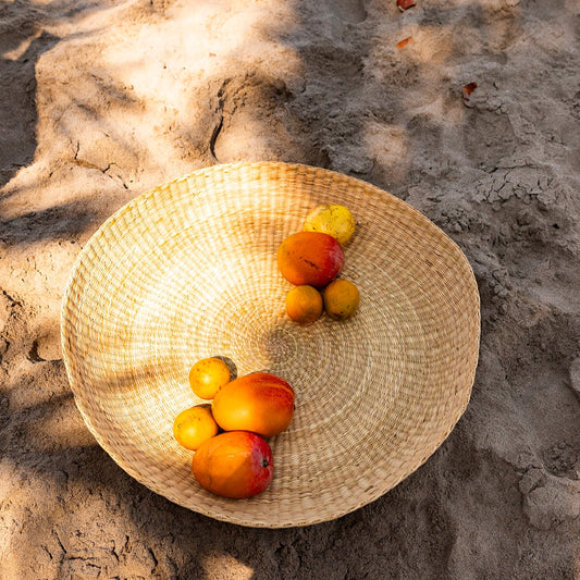 Intiearth Handwoven oversized basket platter made of natural fibers, ideal as a serving dish or decorative centerpiece.