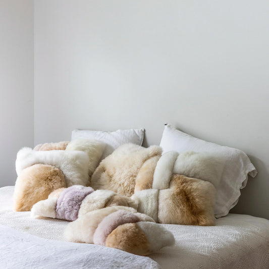 Intiearth FW24 Alpaca Colorblock Pillows on bed