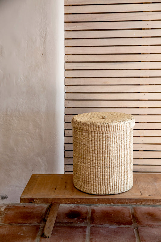 Intiearth Las Pocitas handwoven lidded basket in neutral tones, perfect for use as a laundry basket or stylish storage bin. Adds elegance and versatility to home organization.