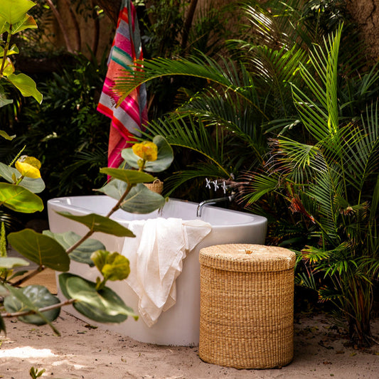 Intiearth Las Pocitas handwoven lidded basket in neutral tones, perfect for use as a laundry basket or stylish storage bin. Adds elegance and versatility to home organization.