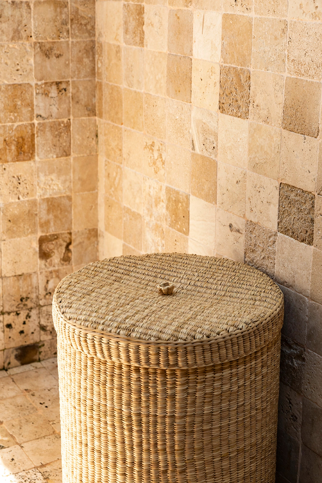 Intiearth Las Pocitas handwoven lidded basket in neutral tones, perfect for use as a laundry basket or stylish storage bin. Adds elegance and versatility to home organization.