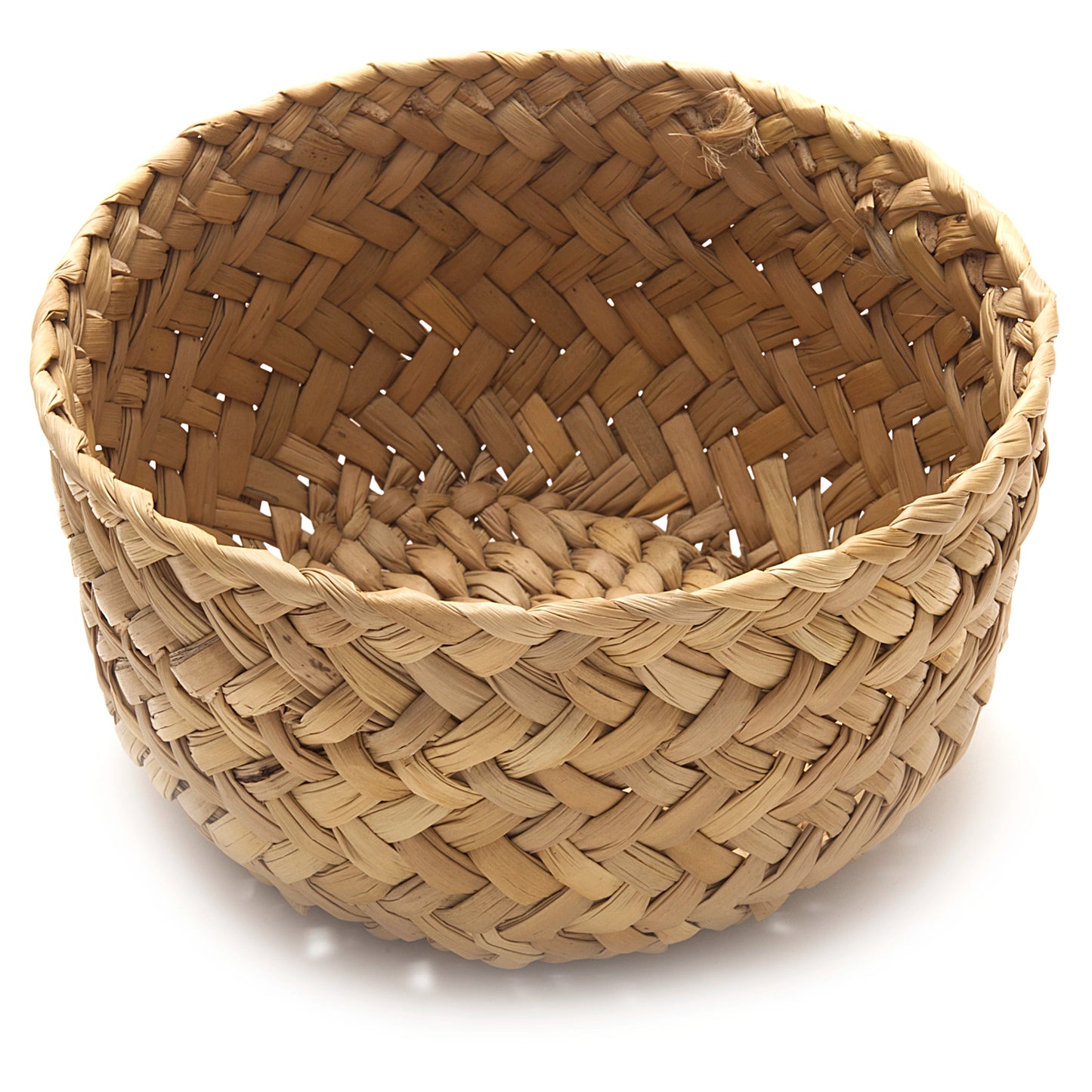 Woven basket with a herringbone pattern on a white background