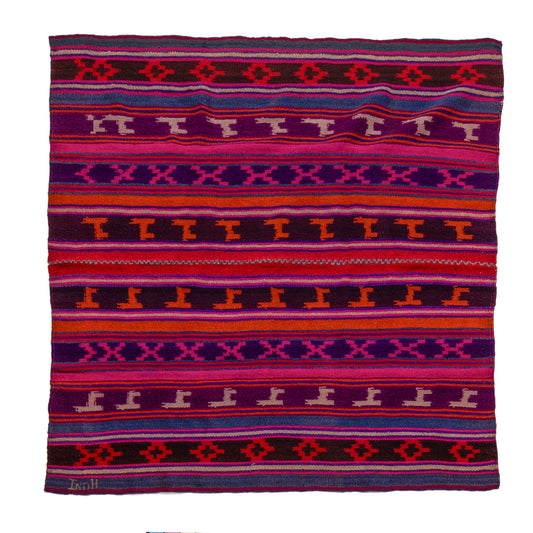 Colorful patterned fabric with geometric design on a white background