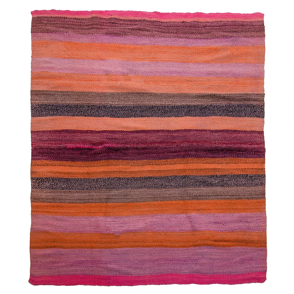 A rectangular woven rug with horizontal stripes in shades of pink, orange, purple, brown, and gray, shown flat against a white background.