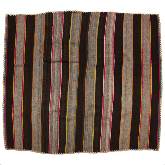 Intiearth vintage Peruvian Frazada textile with colorful geometric patterns and stripes. Traditional handwoven multipurpose textile from Peru, ideal for home décor, can be used as a blanket, rug, throw, or wall hanging. Made of handspun wool and crafted on a backstrap loom.
