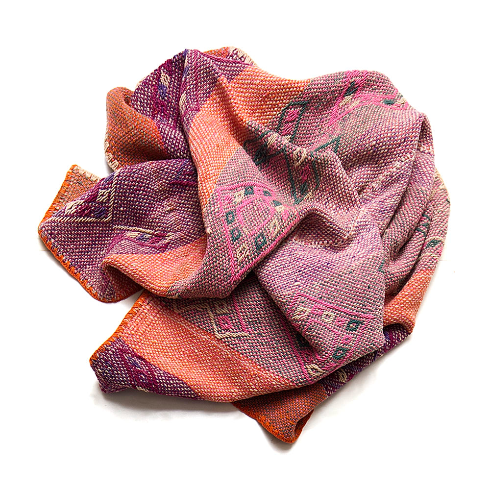 Intiearth vintage Peruvian Frazada textile with colorful geometric patterns and stripes. Traditional handwoven multipurpose textile from Peru, ideal for home décor, can be used as a blanket, rug, throw, or wall hanging. Made of handspun wool and crafted on a backstrap loom.
