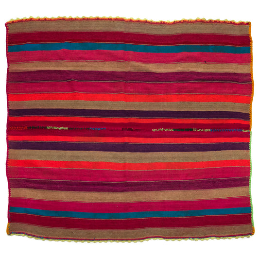 Intiearth vintage Peruvian Frazada textile with colorful geometric patterns and stripes. Traditional handwoven multipurpose textile from Peru, ideal for home décor, can be used as a blanket, rug, throw, or wall hanging. Made of handspun wool and crafted on a backstrap loom.