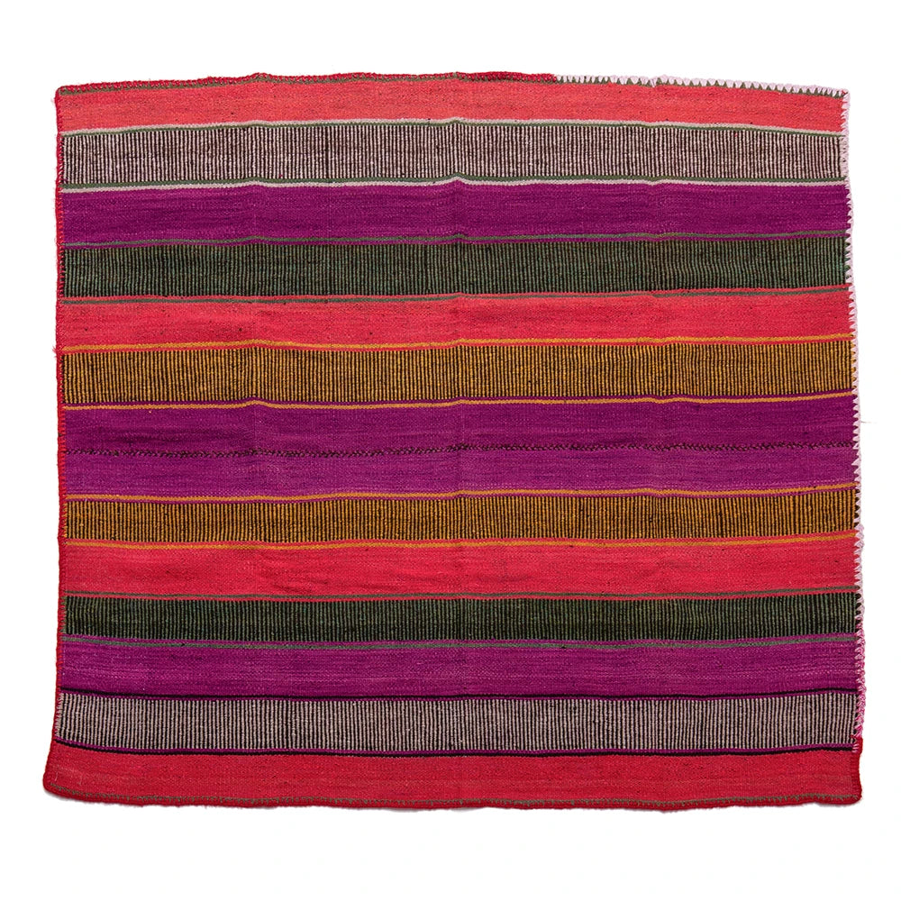 Striped fabric with red, purple, green, and brown colors on a white background