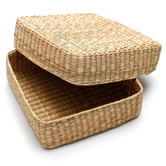 Woven storage basket with a lid on a white background