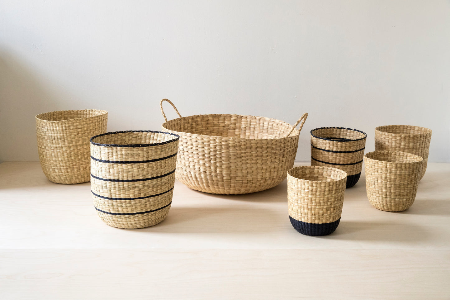 Intiearth Nesting Baskets in natural and black. Giving floor baskets. Creative home storage containers.
