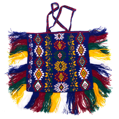 Colorful handbag with intricate patterns and fringes on a white background