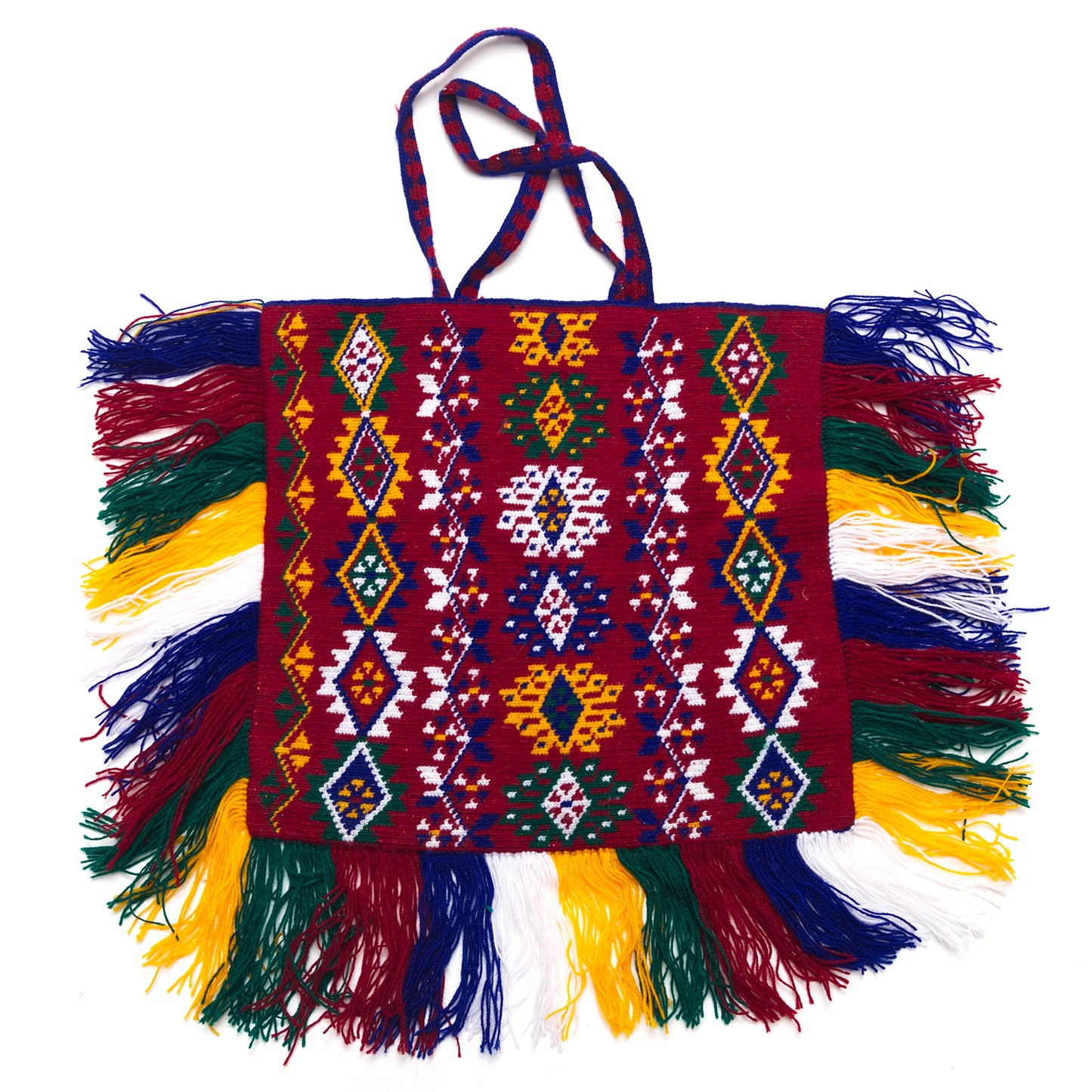 Colorful handbag with intricate patterns and fringes on a white background