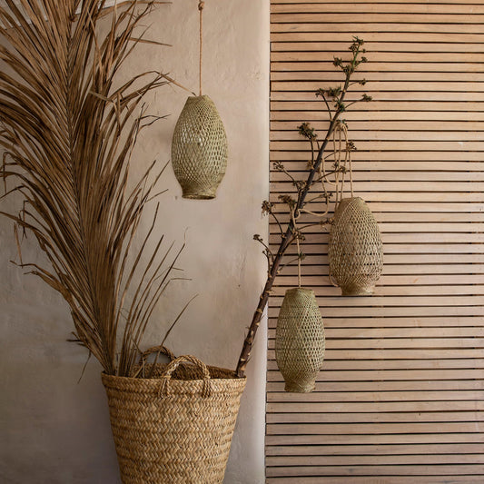 Intiearth  Handwoven wicker pendant lamp with a natural, rustic design, casting a warm, inviting glow—perfect for adding an artisanal touch to any room.

