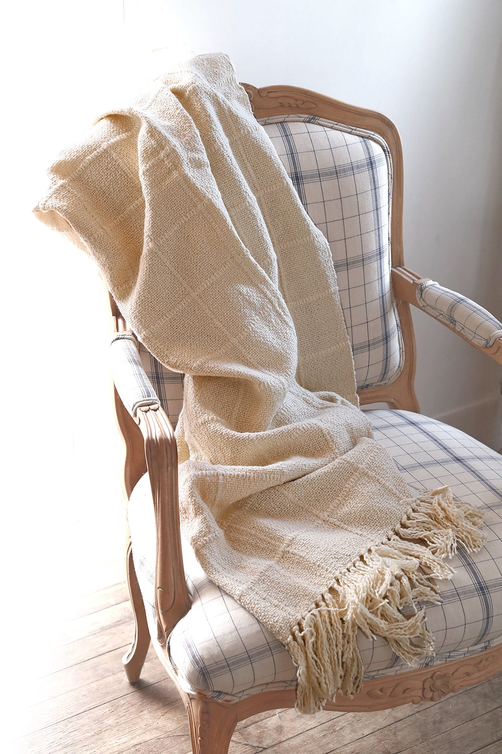 Intiearth_Caral_Collection_Grid_cotton_blanket_throw on blue chair
