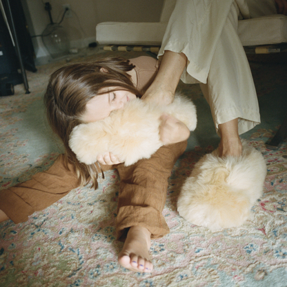 Intiearth_Cozy_Alpaca_Slippers_on_chair_Annelise_Philipps.png