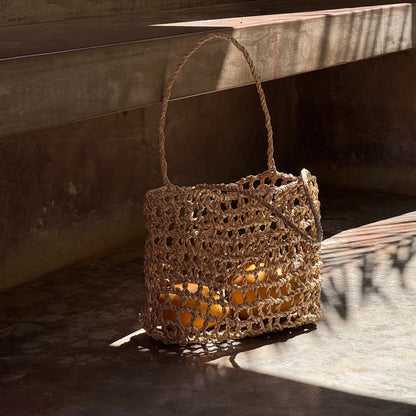 Intiearth Handwoven tote bag inspired by the ancient shicra style, made from natural fibers with an open weave pattern.