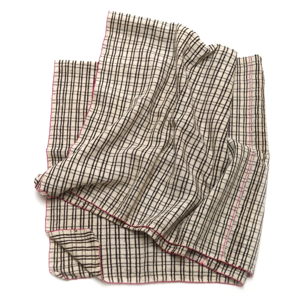 Folded checkered fabric on a white background