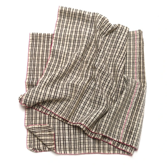 Folded checkered fabric on a white background