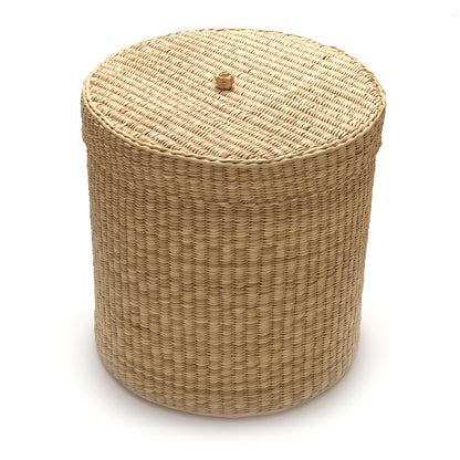 Round woven ottoman on a white background