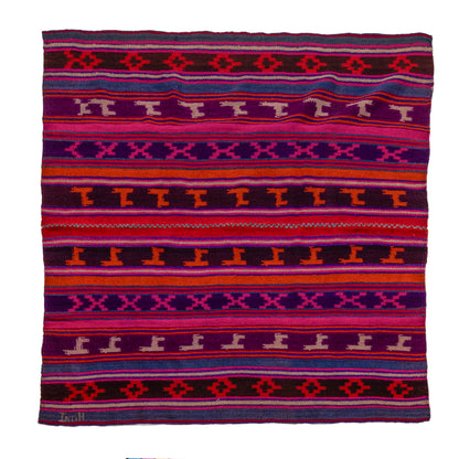 Colorful patterned fabric with geometric design on a white background
