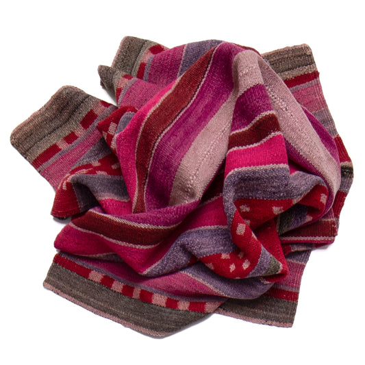Folded striped sock with red, purple, and brown colors on a white background