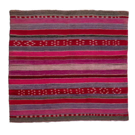Striped fabric with pink, purple, and red colors on a white background