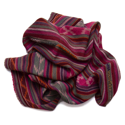 Striped fabric with pink, purple, and orange pattern on a white background