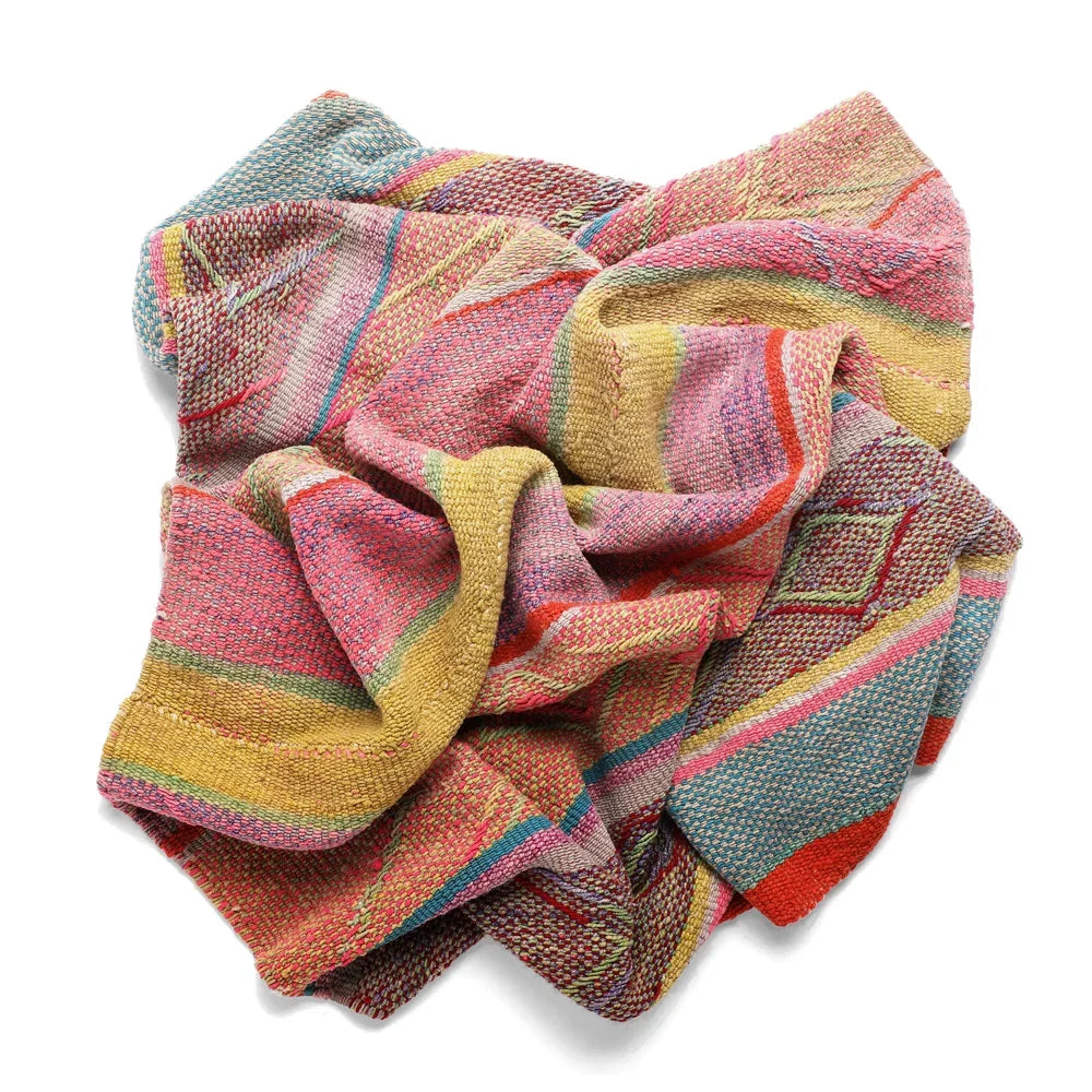 Intiearth vintage Peruvian Frazada textile with colorful geometric patterns and stripes. Traditional handwoven multipurpose textile from Peru, ideal for home décor, can be used as a blanket, rug, throw, or wall hanging. Made of handspun wool and crafted on a backstrap loom.