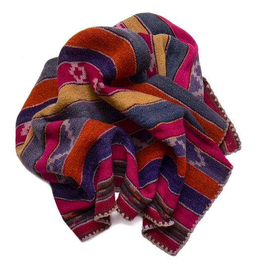 Colorful patterned fabric roll on a white background