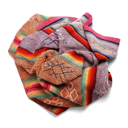 Intiearth vintage Peruvian Frazada textile with colorful geometric patterns and stripes. Traditional handwoven multipurpose textile from Peru, ideal for home décor, can be used as a blanket, rug, throw, or wall hanging. Made of handspun wool and crafted on a backstrap loom.