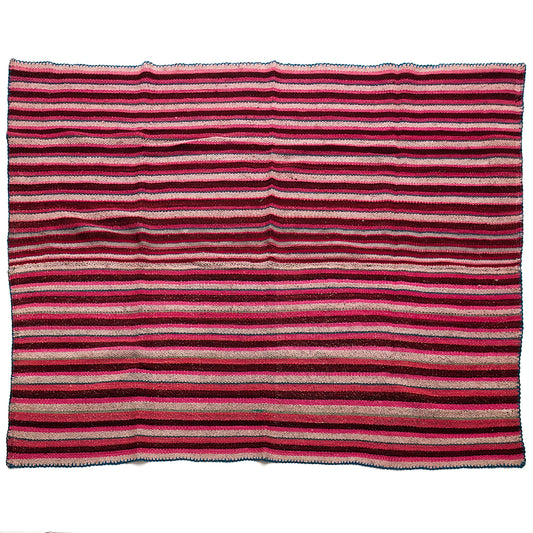Intiearth vintage Peruvian Frazada textile with colorful geometric patterns and stripes. Traditional handwoven multipurpose textile from Peru, ideal for home décor, can be used as a blanket, rug, throw, or wall hanging. Made of handspun wool and crafted on a backstrap loom.