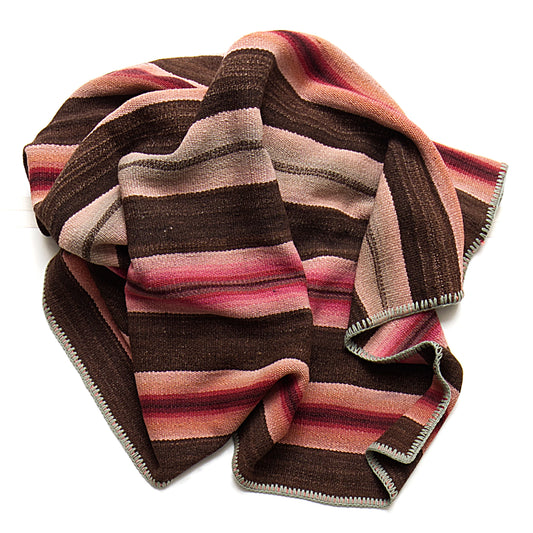 Intiearth vintage Peruvian Frazada textile with colorful geometric patterns and stripes. Traditional handwoven multipurpose textile from Peru, ideal for home décor, can be used as a blanket, rug, throw, or wall hanging. Made of handspun wool and crafted on a backstrap loom.