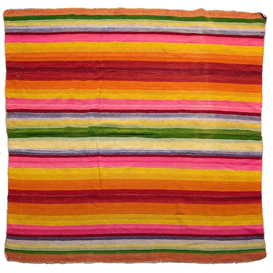 Intiearth vintage Peruvian Frazada textile with colorful geometric patterns and stripes. Traditional handwoven multipurpose textile from Peru, ideal for home décor, can be used as a blanket, rug, throw, or wall hanging. Made of handspun wool and crafted on a backstrap loom.