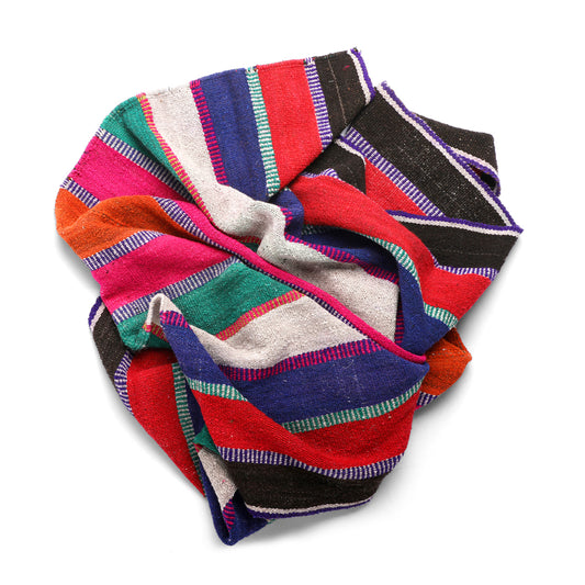 Intiearth vintage Peruvian Frazada textile with colorful geometric patterns and stripes. Traditional handwoven multipurpose textile from Peru, ideal for home décor, can be used as a blanket, rug, throw, or wall hanging. Made of handspun wool and crafted on a backstrap loom.
