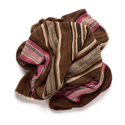 A folded striped woven textile, likely a blanket, throw, or scarf, featuring horizontal bands of brown, beige, pink, and dark brown on a white background.