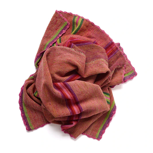 A textured woven scarf in a dusty rose-brown color, featuring stripes of purple, red, and green, finished with a pink scalloped edge, shown on a plain white background.
