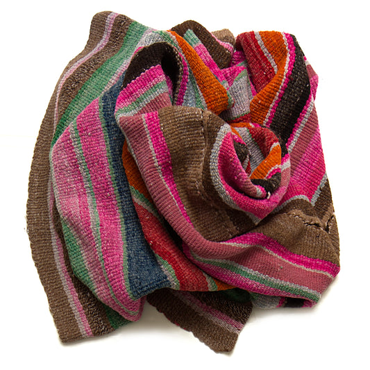 Intiearth vintage Peruvian Frazada textile with colorful geometric patterns and stripes. Traditional handwoven multipurpose textile from Peru, ideal for home décor, can be used as a blanket, rug, throw, or wall hanging. Made of handspun wool and crafted on a backstrap loom.
