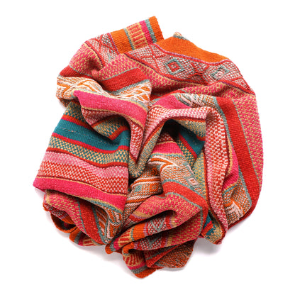 Intiearth vintage Peruvian Frazada textile with colorful geometric patterns and stripes. Traditional handwoven multipurpose textile from Peru, ideal for home décor, can be used as a blanket, rug, throw, or wall hanging. Made of handspun wool and crafted on a backstrap loom.
