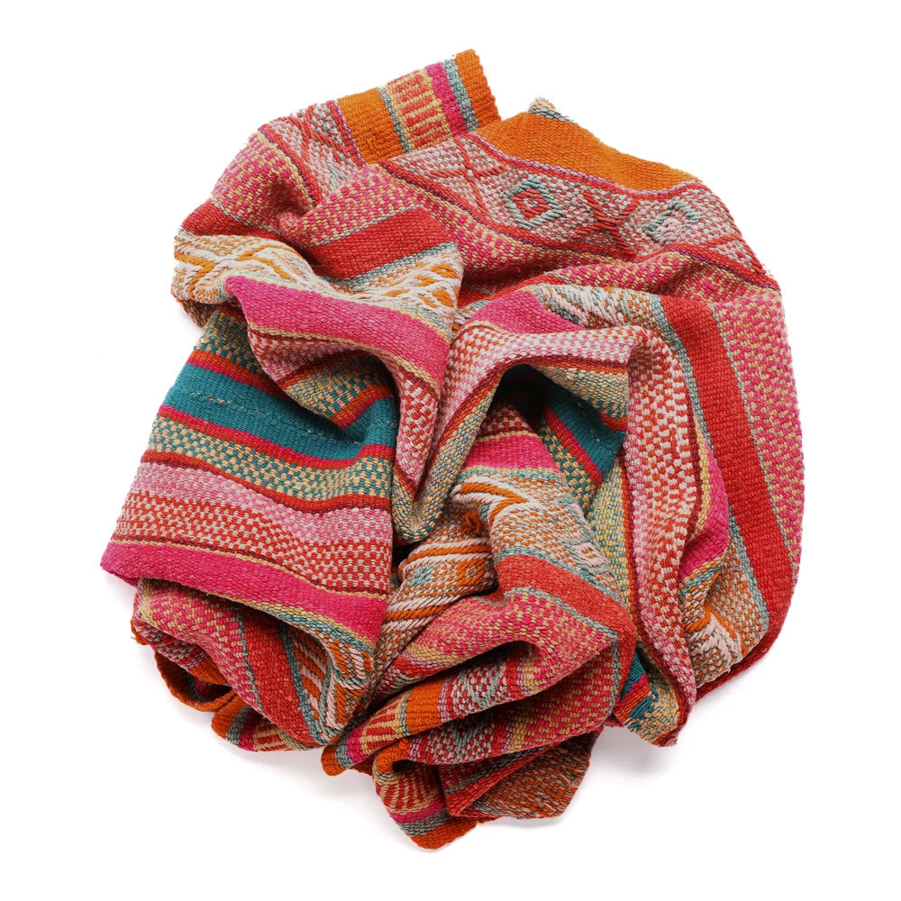 Intiearth vintage Peruvian Frazada textile with colorful geometric patterns and stripes. Traditional handwoven multipurpose textile from Peru, ideal for home décor, can be used as a blanket, rug, throw, or wall hanging. Made of handspun wool and crafted on a backstrap loom.