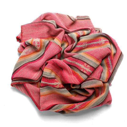 Pink and orange striped towel on a white background