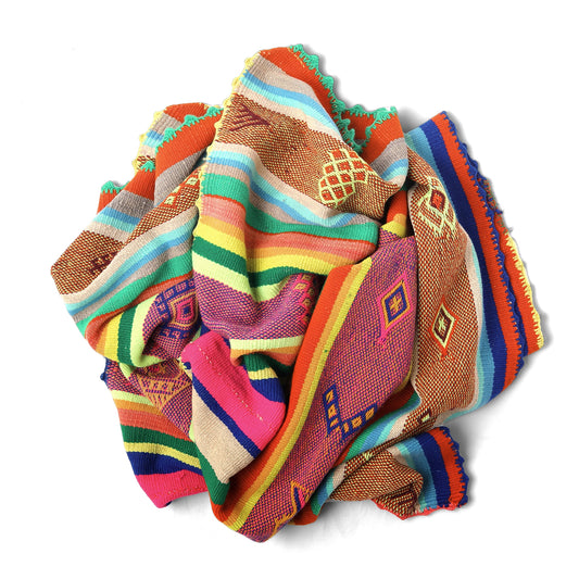Intiearth vintage Peruvian Frazada textile with colorful geometric patterns and stripes. Traditional handwoven multipurpose textile from Peru, ideal for home décor, can be used as a blanket, rug, throw, or wall hanging. Made of handspun wool and crafted on a backstrap loom.