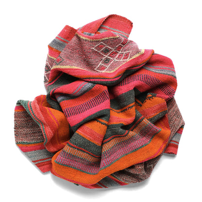 Intiearth vintage Peruvian Frazada textile with colorful geometric patterns and stripes. Traditional handwoven multipurpose textile from Peru, ideal for home décor, can be used as a blanket, rug, throw, or wall hanging. Made of handspun wool and crafted on a backstrap loom.