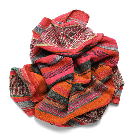 Intiearth vintage Peruvian Frazada textile with colorful geometric patterns and stripes. Traditional handwoven multipurpose textile from Peru, ideal for home décor, can be used as a blanket, rug, throw, or wall hanging. Made of handspun wool and crafted on a backstrap loom.