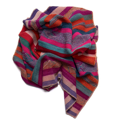 Colorful striped woven textile on a white background