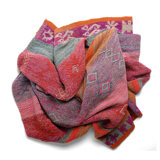 Intiearth vintage Peruvian Frazada textile with colorful geometric patterns and stripes. Traditional handwoven multipurpose textile from Peru, ideal for home décor, can be used as a blanket, rug, throw, or wall hanging. Made of handspun wool and crafted on a backstrap loom.