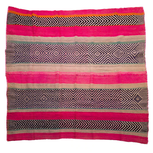 Woven textile with geometric patterns in pink, black, and beige on a white background